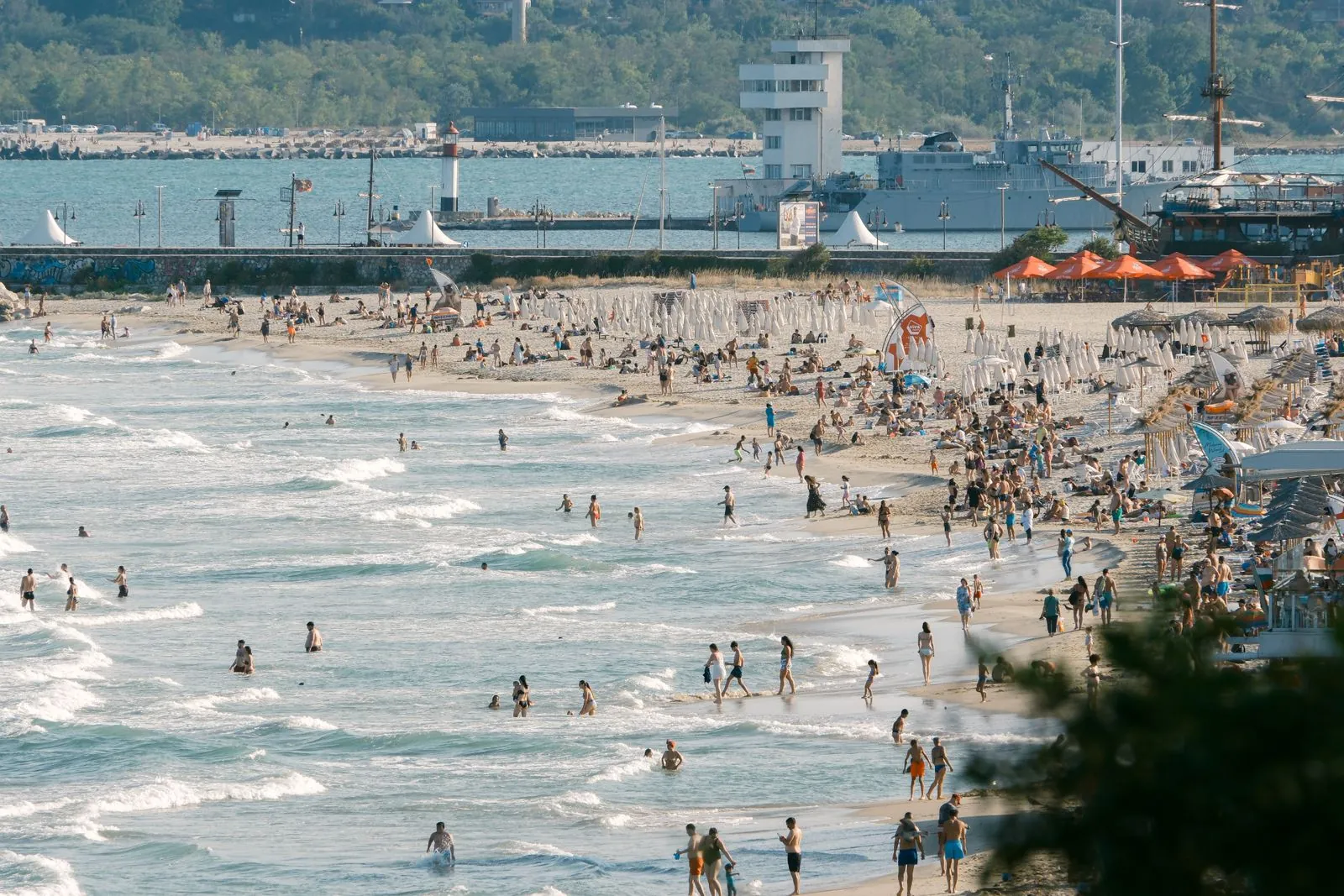 Busy sandy beach on a sunny summer day on the Bulgarian Black Sea coast. Photo by Ramon Karolan.
